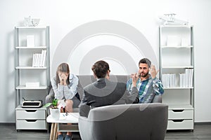 Psychologist with young couple, psychotherapist or marriage counselor listen mental health of young couple