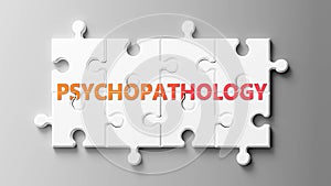 Psychopathology complex like a puzzle - pictured as word Psychopathology on a puzzle to show that it can be difficult and needs