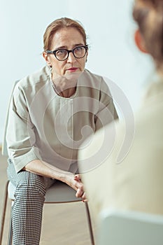 Psychotherapist talking with patient