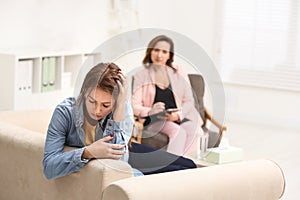 Psychotherapist working with teenage girl