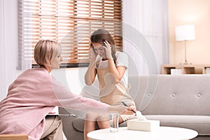 Psychotherapist working with teenage girl