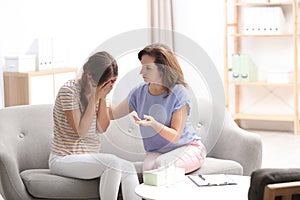 Psychotherapist working with teenage girl