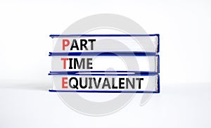 PTE Part time equivalent symbol. Concept words PTE Part time equivalent on books. Beautiful white table white background. Business