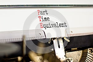 PTE Part time equivalent symbol. Concept words PTE Part time equivalent typed on beautiful retro old typewriter. Beautiful white