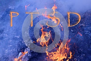 PTSD concept  word fire and flame background photo