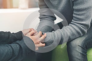 PTSD Mental health concept, Psychologist sitting and touch hand young depressed asian man for encouragement near window, Selective