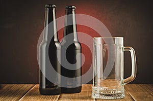 pub with an empty glass and bottles of beer/pub with an empty glass and bottles of beer on a red background