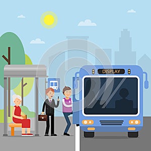 Public autobus station with passengers wich sit in the bus photo