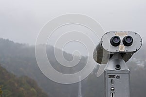 Public Binoculars Machine with the fog in Autumn at Akechidaira Ropeway ,Nikko