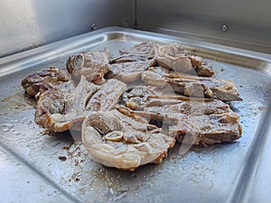 Public camping kitchen, roasting meat lamb