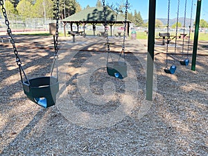 public city park children playground play swing set swings play area