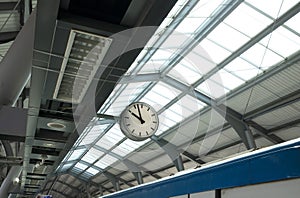 Public clock in sky train station.