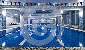 Public competition swimming pool interior in fitness gym