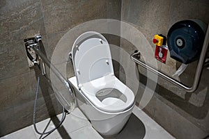Public disabled toilet in a large building. Modern restroom for disabled people. Inside disable toilet or elderly people.