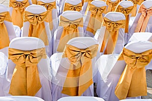 Public Event Seating with Silk Chair Covers and Sashes photo