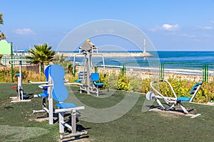 Public fitness equipment on promenade.