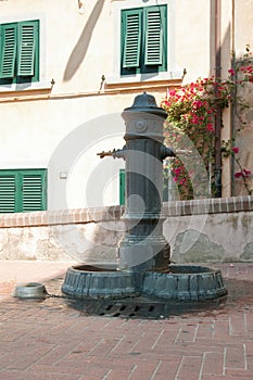 Public fountain in Castagneto Carducci, Tuscany, Italy photo