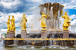 Public fountain of friendship of the people view at VDNH city park exhibition, blue sky and clouds in Moscow, Russia