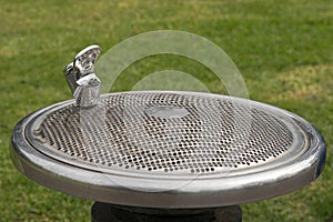 Public free drinking fountain tap, water bubbler, provided at th photo