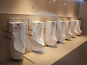 Public gentlemen toilet restroom. Interior and Healthcare concept. Hygiene in shopping mall theme.