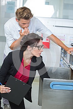 Public inspector inspecting cupboard