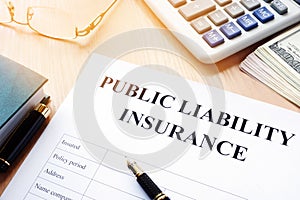 Public liability insurance policy on a desk. photo