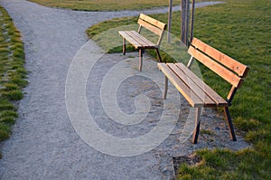 Public multifunctional city playground with green artificial turf. soccer goals. protective white nets and game lines. around are