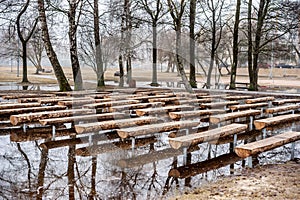 Public Park and Bench on the Water. Early Spring Time. Lithuania, Siauliai.