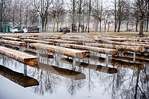 Public Park and Bench on the Water. Early Spring Time. Lithuania, Siauliai.