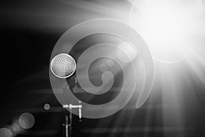 Public performance on stage. Microphone on abstract blurred of speech in seminar room or speaking conference hall