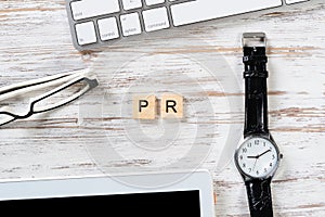Public relations concept with PR letters on cubes