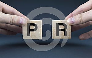 Public Relations. Cubes form the words PR Public Relations