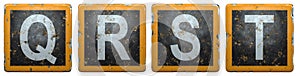 Public road sign orange and black color with a capital set of letters Q, R, S, T in the center isolated on white