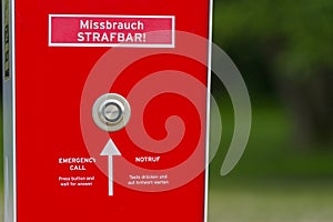 Public safety intercom box in red with emergency button and arrow