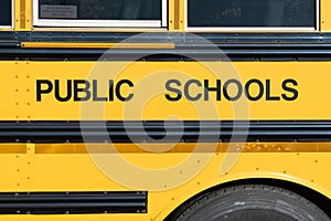 Public schools block lettering on the side of a school bus photo