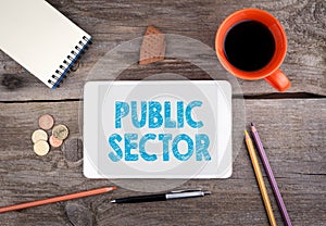 Public Sector. Tablet device on a wooden table