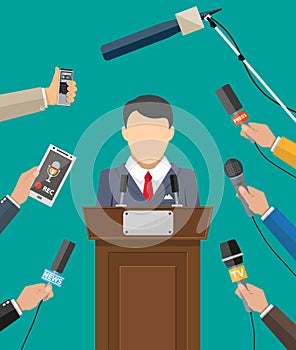 Public speaker and hands of journalists