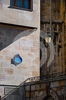 Public street sign of blue color on a wall on the streets of Guernica, Basque Country, Spain.