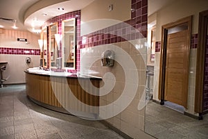 Public toilet restroom hand washing area with  sinks, hand dryers and mirrors