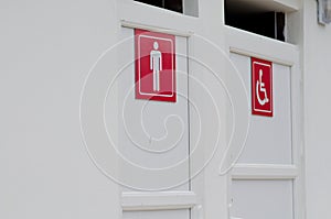 Public toilet. Signs on the public toilet. Social signs