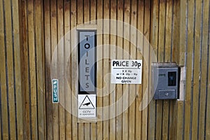 Public toilet WC coin operated pay to use in outdoor park