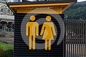 Public toilets are obvious from the bright yellow icons on their wall