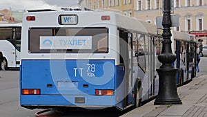 Public toilets in old russian blue bus