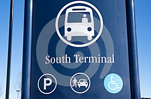 A public transit sign at a bus terminal