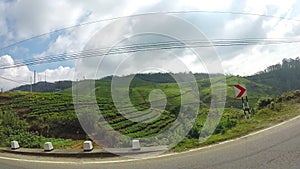 Public transport bus passing on road in beautiful Sri Lanka.