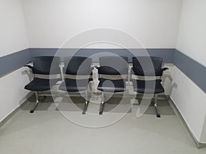 Public waiting seats in a row. Hospital or government building chairs, conference.