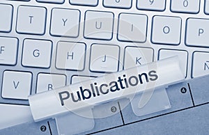 Publications - Inscription on Blue Keyboard Key