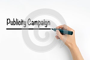 Publicity Campaign. Hand with marker writing on a white background