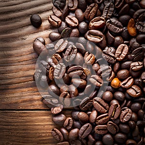 Publish Coffee beans arranged on a wooden table, ideal for banners