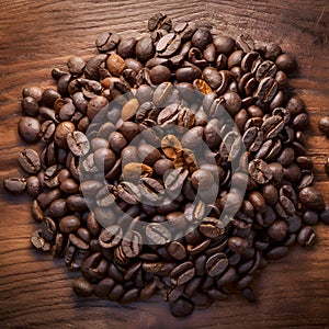 Publish Coffee beans arranged on a wooden table, ideal for banners